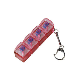 Transparent PC Shaft Tester with Light, pink translucent housing with four clear compartments and a keychain.