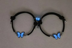 Two black cord butterfly necklaces with blue luminous butterfly charms