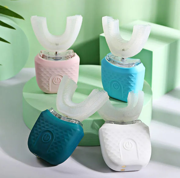 U-shaped ultrasonic electric toothbrushes by Phora'store, four pastel units in pink, blue, teal, and white.