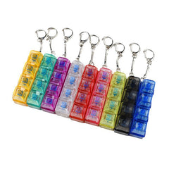 Transparent PC Shaft Tester with Light keychain set in yellow, teal, purple, clear, red, pink, black and blue blocks.