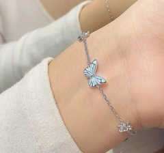 Blue luminous butterfly necklace with a silver chain and blue enamel pendant